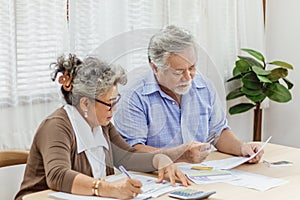 Stressed senior elderly couple conclict of credit card bills or bebt of expense in shopping. Lover financial risk or crisis and