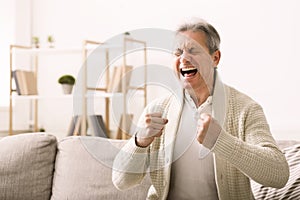 Stressed senior man shouting with aggressive expression