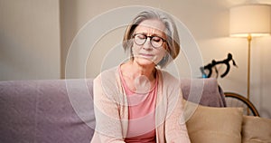 Stressed senior woman at home with internet banking debt, problem and crisis. Retirement, anxiety and elderly person in