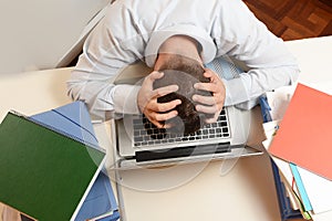 Stressed Student or Businessman head on keyboard