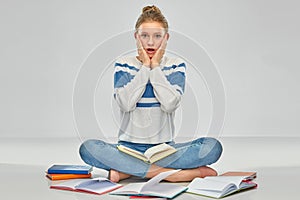 Stressed teenage student girl with books