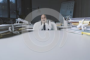 Stressed terrified businessman working in the office