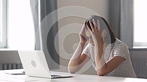 Stressed tired asian businesswoman worker using laptop having computer problem