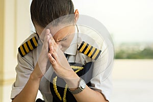 Stressed tired pilot at work