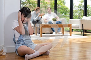 Stressed and unhappy young girl hide from domestic violence at home. Synchronos