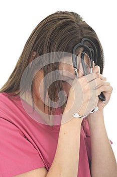 Stressed And Upset Young Female Doctor with Stethoscope