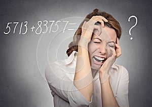 Stressed woman can't solve math problem photo