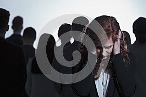 Stressed woman covering her ears photo