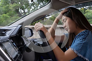 Stressed woman drive car feeling sad and angry. Asian girl tired, fatigue on car. Driver tired drowsy, drink donâ€™t drive concept