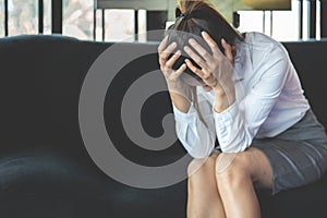 Stressed Woman with Headache on the sofa. Sad Woman.Failure to work