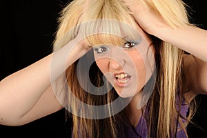 Stressed woman holding head