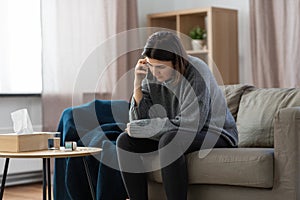 stressed woman with medicine calling on phone