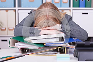 Stressed woman at the office. Concept for burnout and overwork in business situations