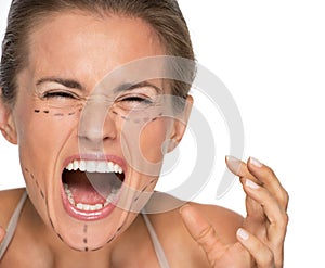 Stressed woman with plastic surgery marks