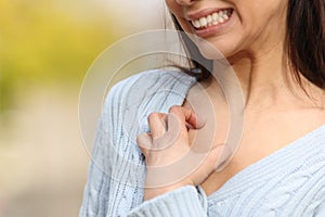 Stressed woman scratching itchy chest