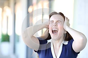 Stressed woman yelling in the street