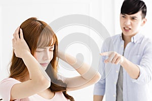 Stressed young asian couple quarreling photo