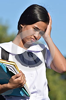 Stressed Young Asian School Girl Wearing School Uniform