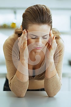 stressed young housewife in kitchen