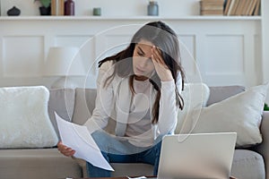 Stressed young lady thinking of financial problems.