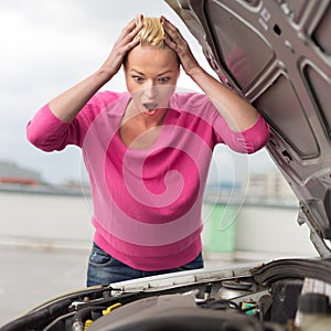 Stressed Young Woman with Car Defect.