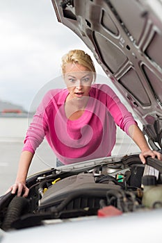 Stressed Young Woman with Car Defect.
