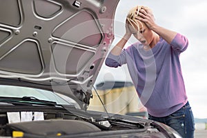 Stressed Young Woman with Engine Breakdown Car Defect