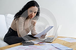 Stressed young woman has financial problems credit card debt to pay crucial