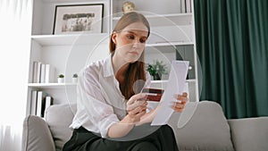 Stressed young woman has financial problems credit card debt to pay. Prim