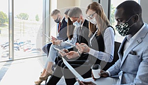 Stressful business people waiting for job interview with face mask, social distancing quarantine during COVID19 affect