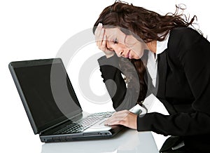 Stressful business woman working on laptop