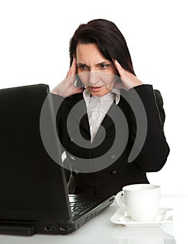 Stressful business woman working on laptop