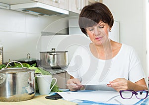 Stressful woman paying bills