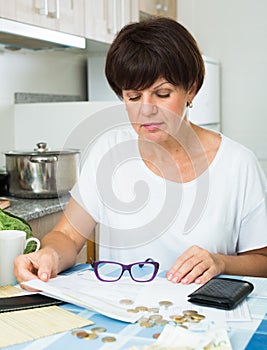 Stressful woman paying bills