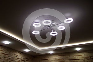 Stretch ceiling and chandelier and spotlights