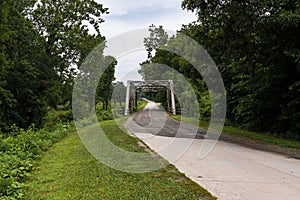 A stretch of the original route 66 wih an old steel bridge in the State of Missouri photo