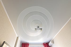 Stretch white matte ceiling in the room