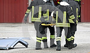 Stretcher with injured person and team of firefighters during re