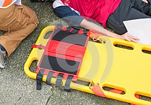 Stretcher yellow and patient injured for emergency paramedic service Injury with medical equipment in emergency rescue situation