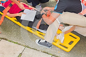 Stretcher yellow and patient injured for emergency paramedic service Injury with medical equipment in emergency rescue situation