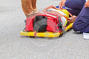 Stretcher yellow and patient injured for emergency paramedic service Injury with medical equipment in emergency rescue situation