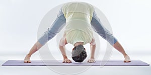 Stretching every muscle. Full length shot of a woman stretching before yoga.