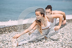 Stretching before everyday jogging on the beach