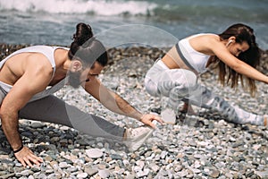 Stretching before everyday jogging on the beach