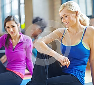 Stretching, fitness and woman in pilates health class for training, exercise and warm up on floor. Smile, muscles and