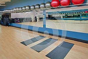 Stretching mats and exercise balls in gym