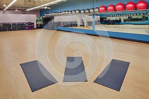 Stretching mats and exercise balls in gym