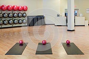 Stretching mats and exercise balls in gym