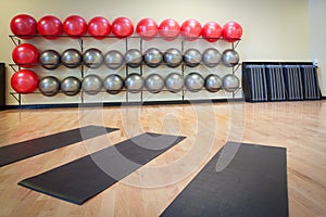 Stretching mats and exercise balls in gym