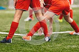 Stretching session for young football players. Youth soccer players warming up before the match